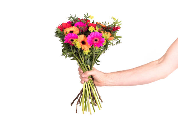 istock Man is giving flowers 1063767878