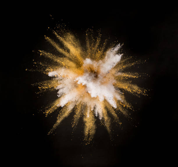 istock Silver and gold powder explosion on black background. 1063768112