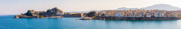 Corfu, Greece - October 16, 2018: Corfu town in panoramic view from the water in Greece