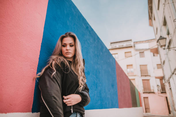 istock Young woman on colorful wall 1063776672