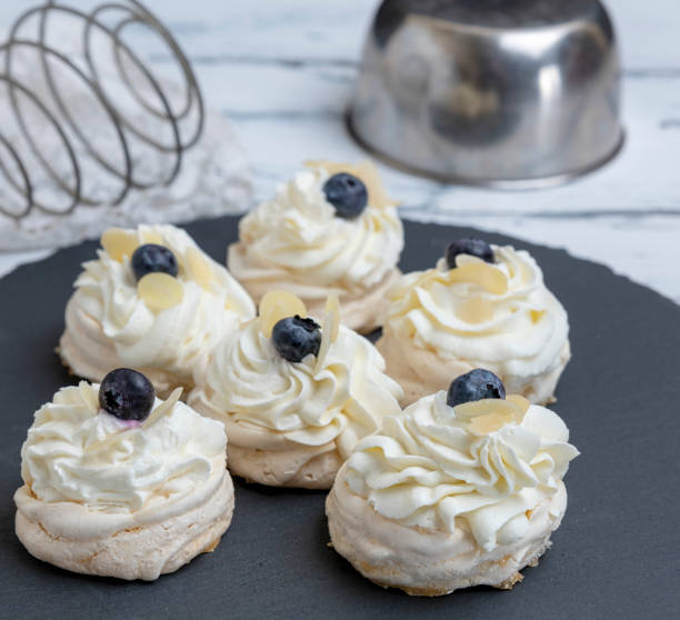 istock baked round meringues with whipped cream 1063777770