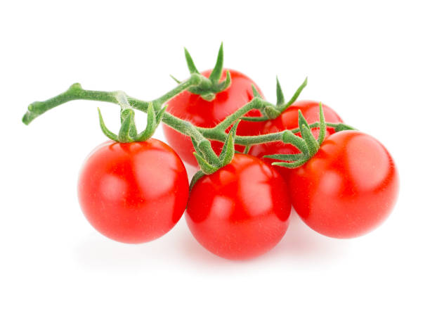istock Bunch of cherry tomatoes isolated on white background 1063779286