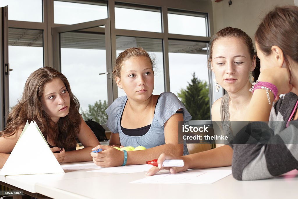 Girls in a school lesson. Four girls at school. This picture was made on the 07/22/2010 in a 7th class in a school in Germany, without models. The children are real pupils in a real lesson. I want to thank all the children and parents for their help to realize this shooting. Teenager Stock Photo