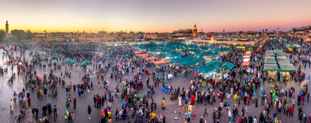 Blue hour Djemaa El Fna Square Koutoubia Mosque Marrakech Morocco Panoramic view of Djemaa el Fna square at sunset in Marrakech. Morocco djemma el fna square stock pictures, royalty-free photos & images