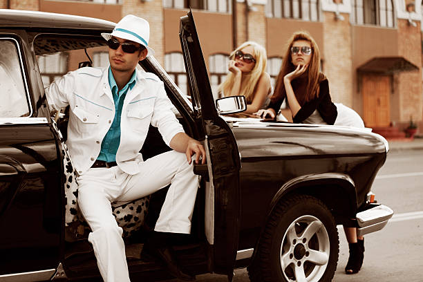 istock Young people with a retro car 106378938