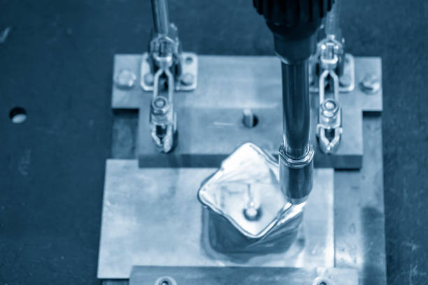 istock The welding robot machine for welding automotive part in the light blue scene. 1063790864
