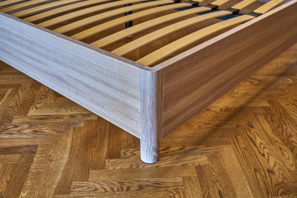 istock Solid wood bed. Modern Scandinavian style. Close-up. Empty bedroom 1063792380