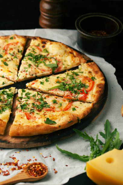 istock Delicious pizza margherita with arugula and basil 1063792858