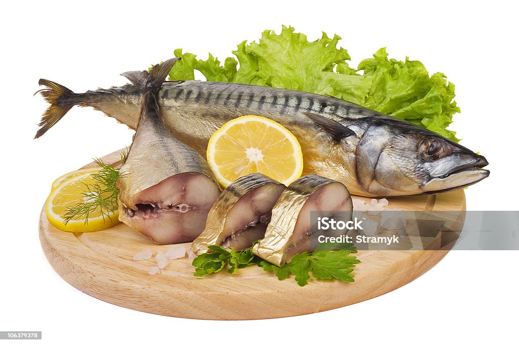 Composition with mackerel fish A composition with mackerel fish on wooden plate isolated on white Mackerel Stock Photo