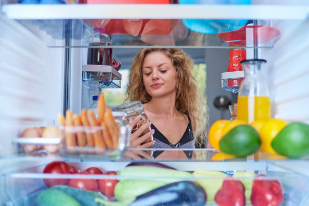 istock Woman taking jar from fridge. 1063793952