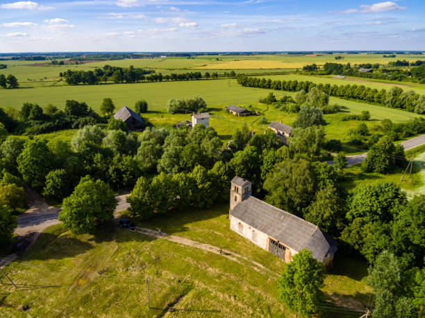 istock drone image. aerial view of rural area with fields and forests with river and water reflections 1063795936