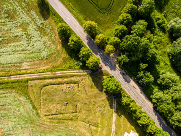 istock drone image. aerial view of rural area with fields and forests with river and water reflections 1063795946