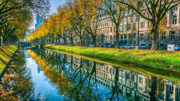 Autumn reflection scenery at a German street Canal reflection scenery shot in November at the Königsallee in Düsseldorf, Germany düsseldorf stock pictures, royalty-free photos & images