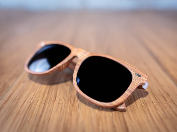 istock Trendy wooden sunglasses on a table 1063810040