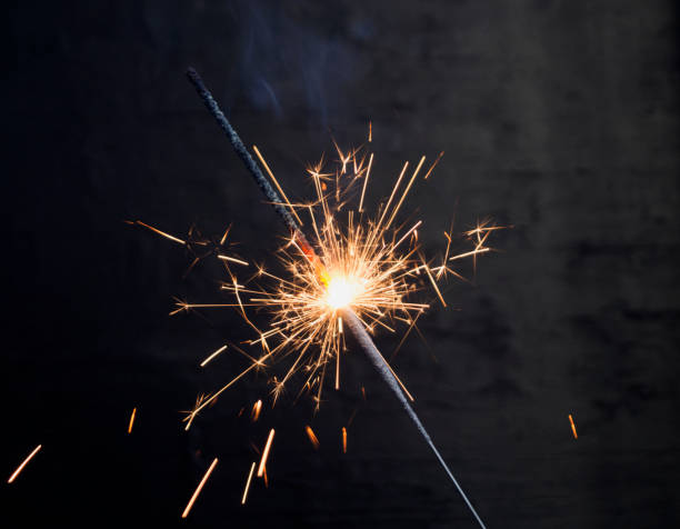 istock Sparkler. Christmas Sparkler on a black background. 1063810064