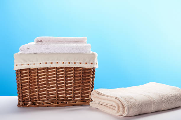 istock laundry basket and clean soft towels on blue 1063810750