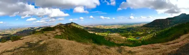 Purandar fort landscape scene in winter season, dry meadows and blue cloudy sky, Pune, Maharashtra, India