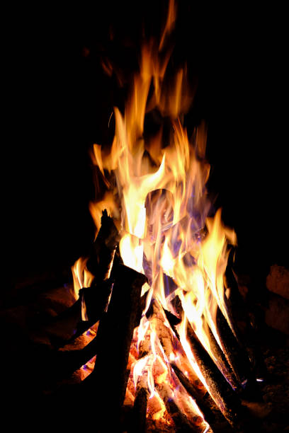 istock Fire flames close up over black background 1063811724