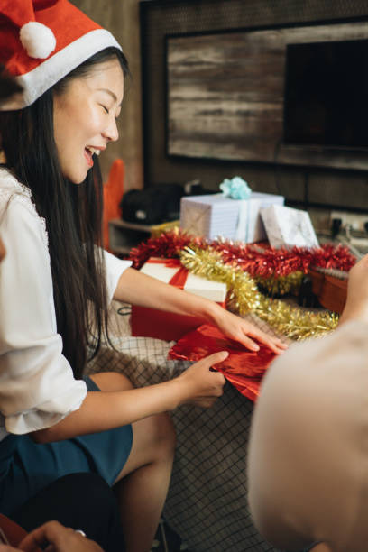 istock Friends Wrapping Gift Together for Christmas Day 1063813234