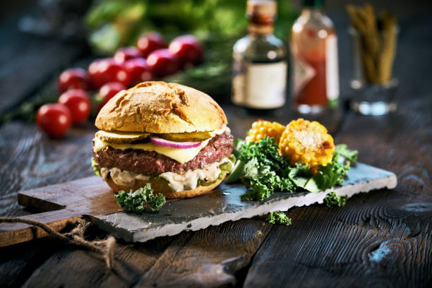 istock Homemade delicious hamburger on aged wooden table 1063813548