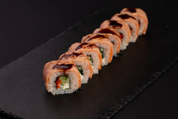 istock Japanese cold roll with salmon on black background 1063813616