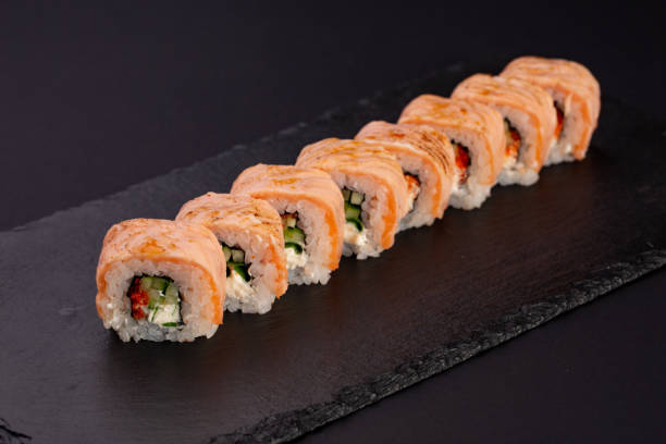 istock Japanese cold roll with salmon on black background 1063813850