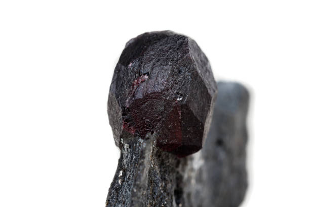 istock Macro mineral stone garnet  in the rock on a white background 1063814612