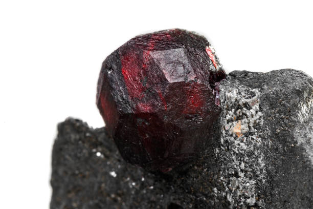 istock Macro mineral stone garnet  in the rock on a white background 1063815502