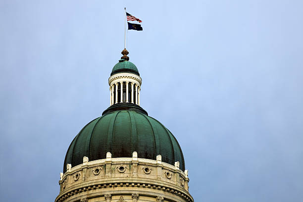 istock Ornate dome of a state capitol with flags flying at the top 106381786