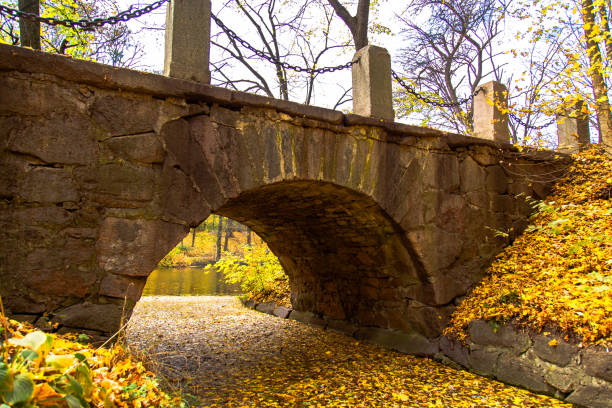istock autumn park stone arch bridge 1063820416
