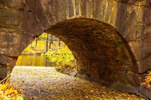 istock autumn park stone arch bridge 1063820790