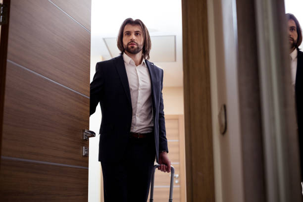istock Nice young businessman entering the hotel room 1063821672
