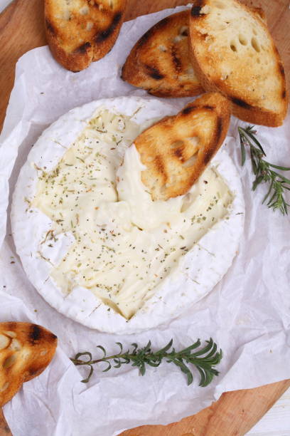 istock Camembert with grilled baguette and olives 1063822176