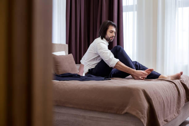 istock Nice handsome man resting in the room 1063822514