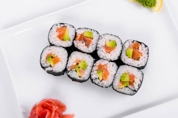 istock Asian food. Rolls with salmon (red fish) on a white plate on a white background 1063825070