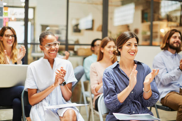 istock Group of people listening to a presentation speech. 1063825422