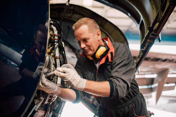 istock Mechanic repairing aircraft 1063826110