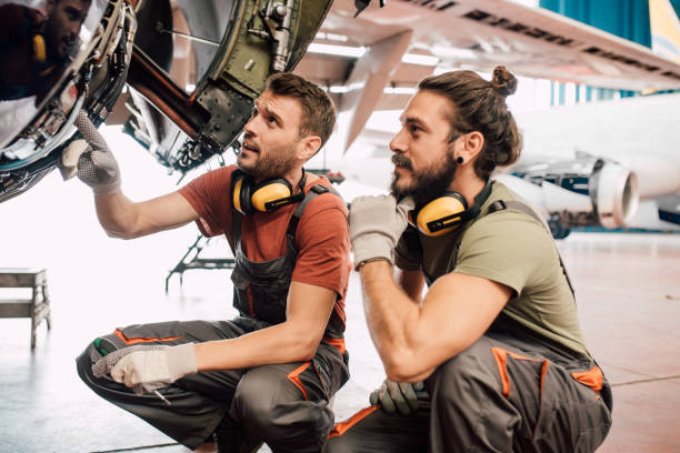 istock Young men repairing aircraft 1063826186
