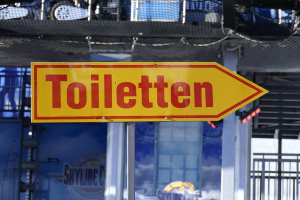 istock Toilet sign, signpost, arrow 1063827376