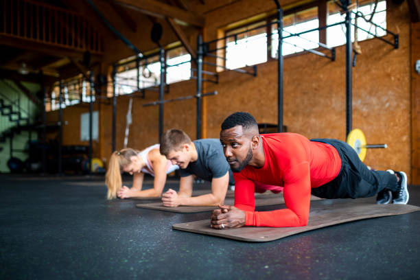 istock Athletes doing plank exercise at the gym 1063829638