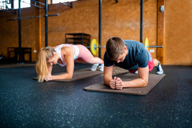 istock Athletes doing plank exercise at the gym 1063829674