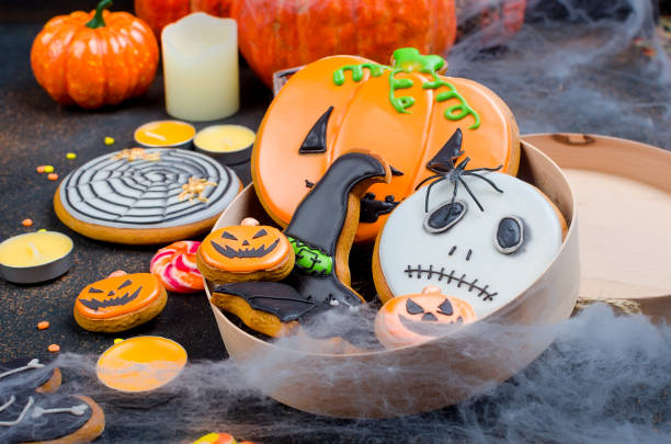 istock Halloween background with gingerbread, pumpkins and candles 1063829952
