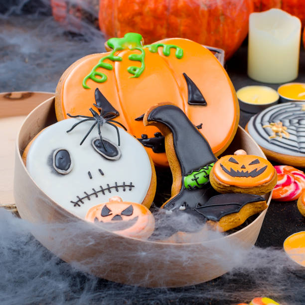 istock Halloween background with gingerbread, pumpkins and candles 1063830124