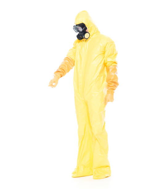 istock Man in protective clothing and pointing down 1063831434