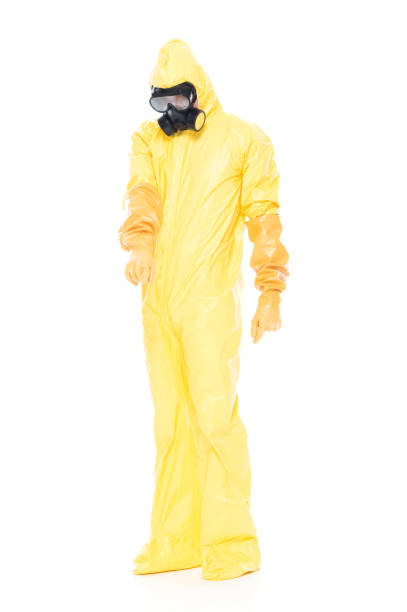 istock Man in protective clothing and pointing down 1063831462