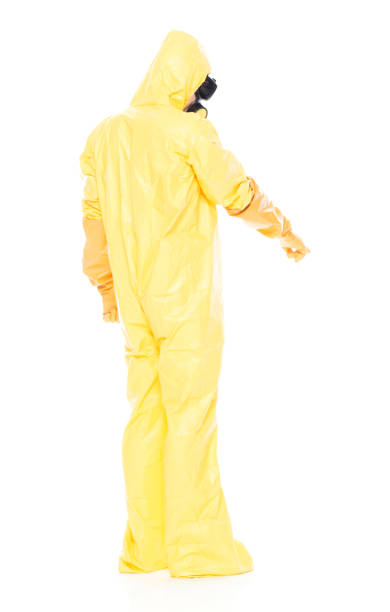 istock Man in protective clothing and pointing down 1063831476