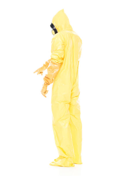 istock Man in protective clothing and pointing down 1063831480