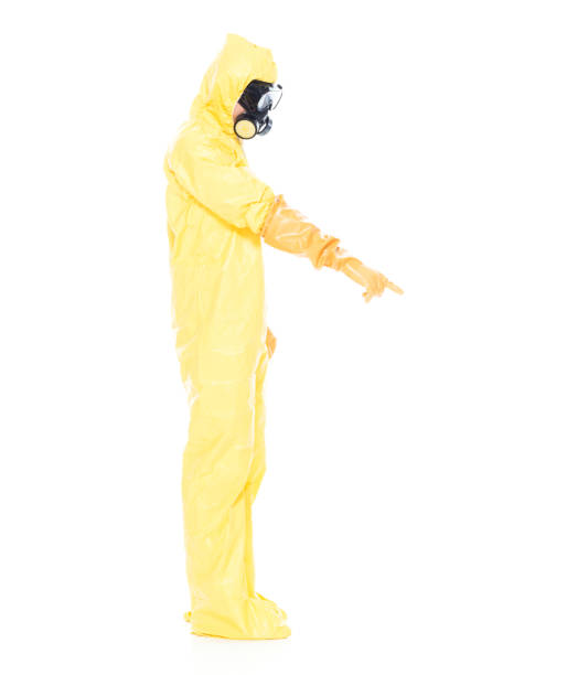 istock Man in protective clothing and pointing down 1063831506