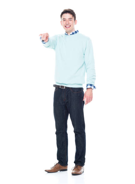 istock Handsome young man pointing with one hand 1063831654