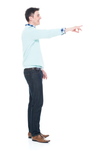 istock Handsome young man pointing with one hand 1063831682